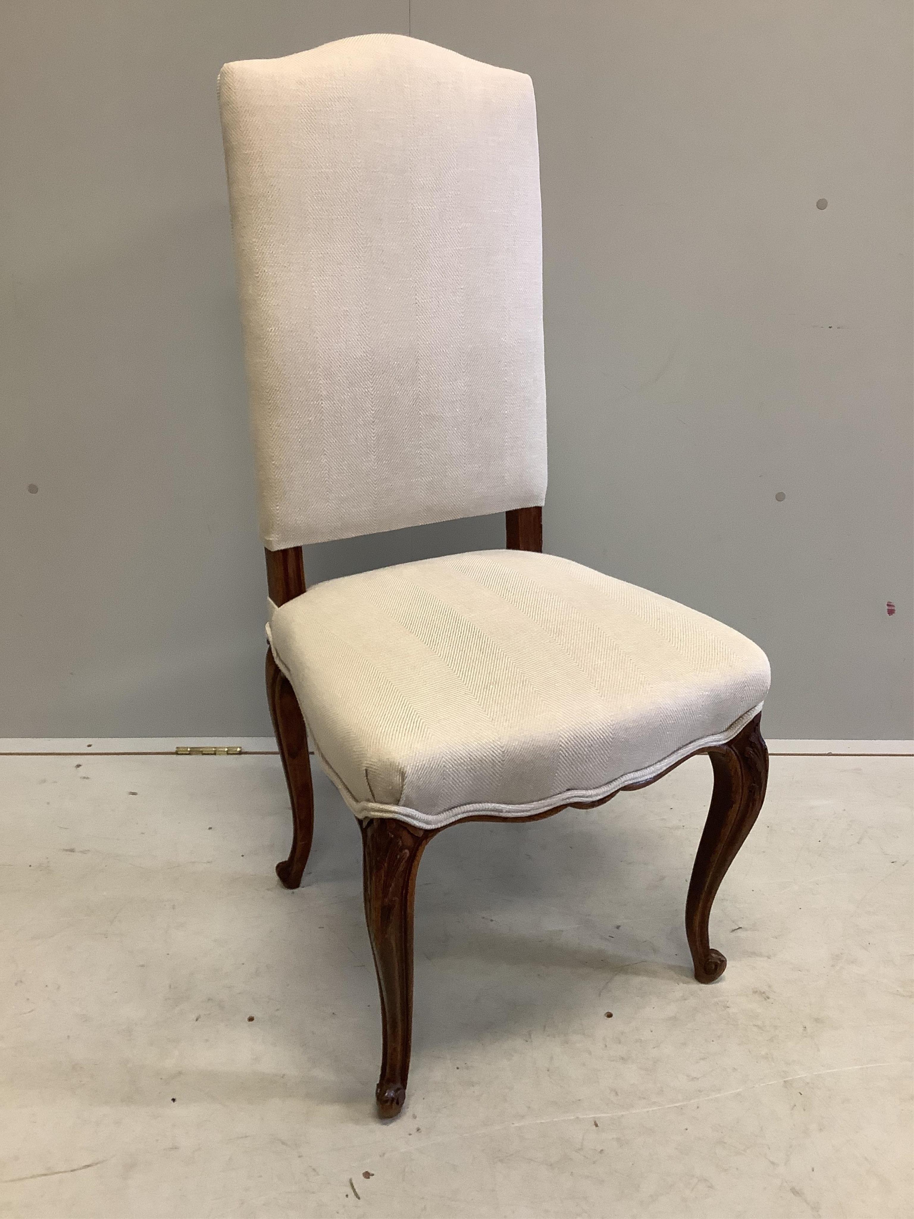 A set of eight 19th century French oak dining chairs, recently re-upholstered in a natural colour fabric, width 50cm, depth 46cm, height 106cm. Condition - good